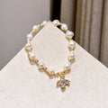 Light luxury natural pearl bracelet women's exquisite zircon flower pendant niche design sense is versatile and gentle style hand jewelry