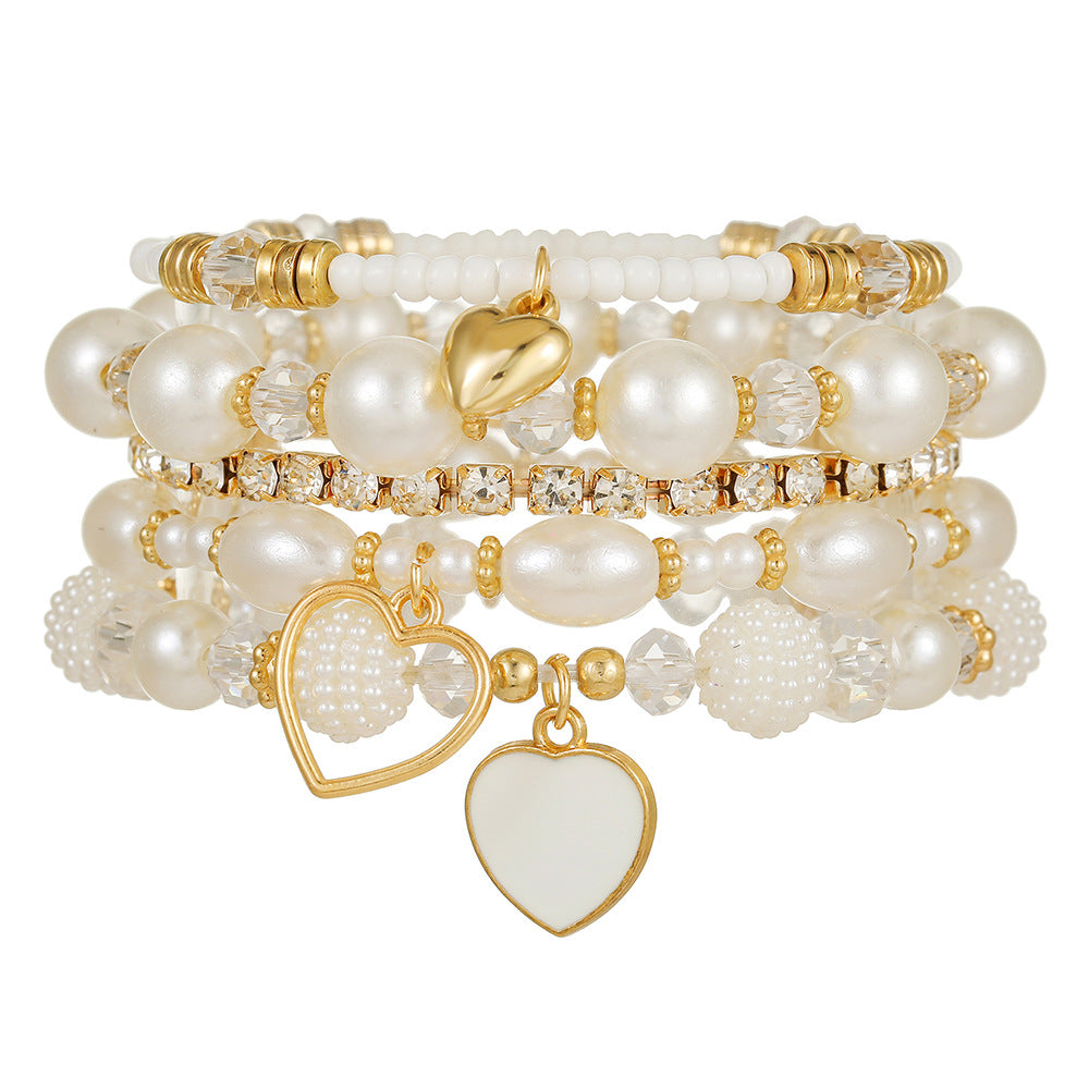 Cross-border European and American 5-piece bracelet, imitation pearl handmade beaded female Bohemian fashion dripping oil peach heart bracelet female