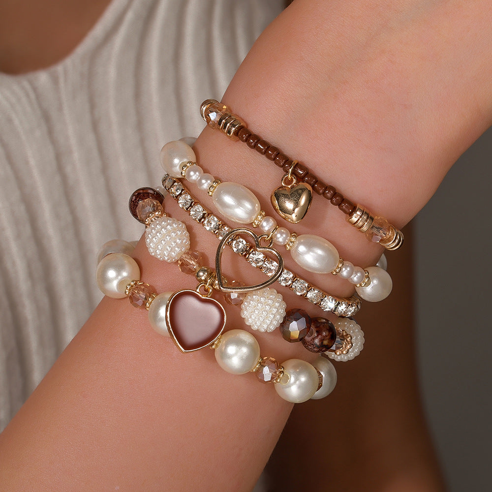 Cross-border European and American 5-piece bracelet, imitation pearl handmade beaded female Bohemian fashion dripping oil peach heart bracelet female